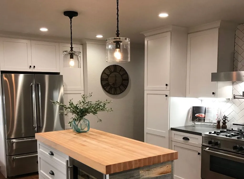 Butcher block kitchen island with two pendant lights