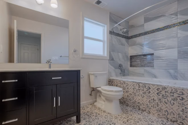A master bath featuring graphic design tiles