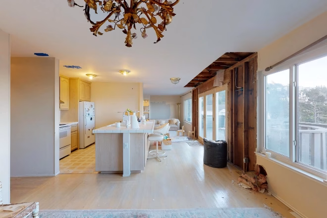 An older kitchen in the demolition step of a kitchen remodel.