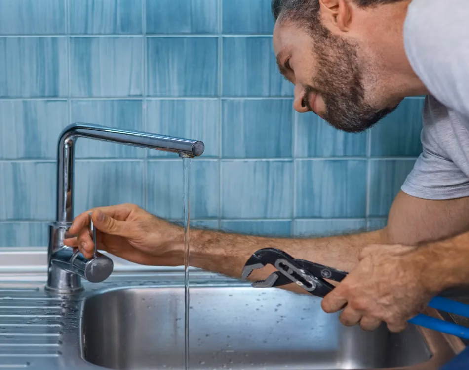 Checking kitchen sink for leaks