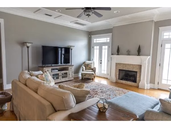 Living room with two focal points of a fireplace and television